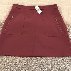 NWT LOFT raspberry colored mini skirt.  A-line with adorable zipper details